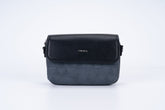 Black women's shoulder bag with a long strap, small size, and elegant design.