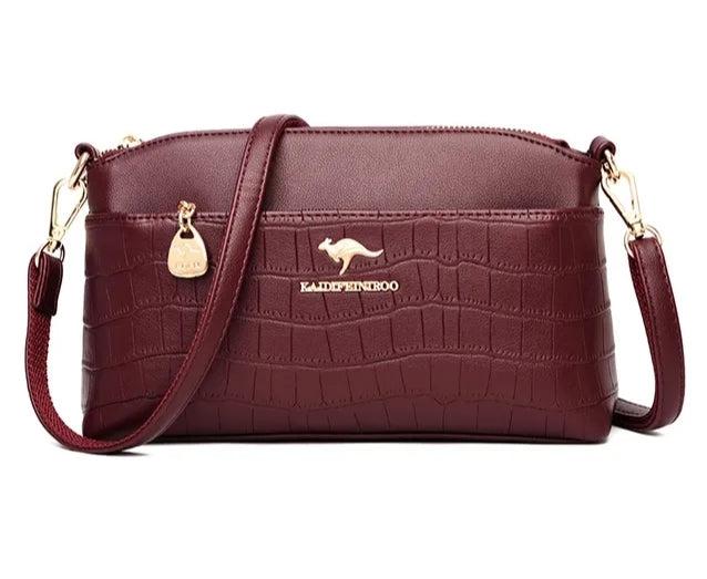 Fashionable women's handbag of flexible leather - Wine red